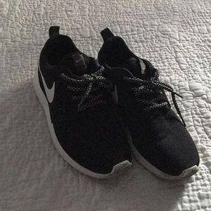 Black and white nike running shoes